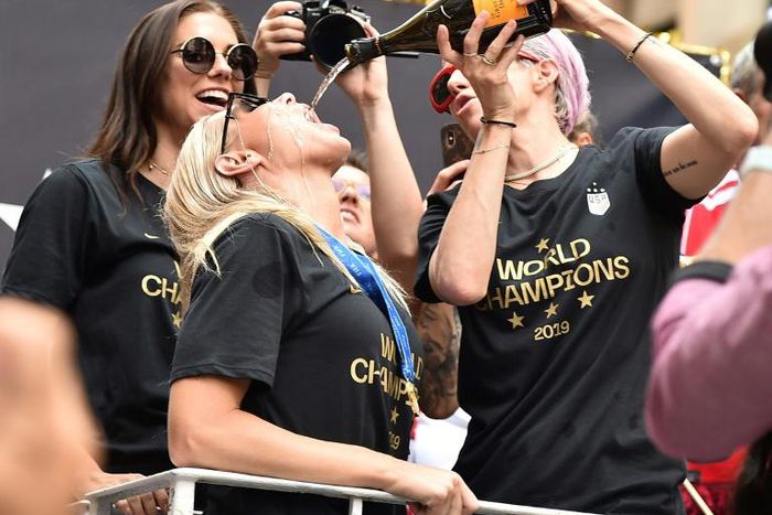 US Women's World Cup players celebrating during a victory parade in New York will have better conditions around matches under terms of a settlement deal
