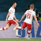 Robert Lewandowski's (L) header earned Poland a valuable point in Seville