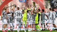 Juventus goalkeeper Gianluigi Buffon holds the Coppa Italia trophy.
