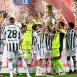 Juventus goalkeeper Gianluigi Buffon holds the Coppa Italia trophy.
