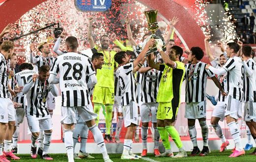 Juventus goalkeeper Gianluigi Buffon holds the Coppa Italia trophy.