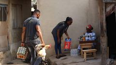 Lance Corporal Simon Agbeko gives to the aged