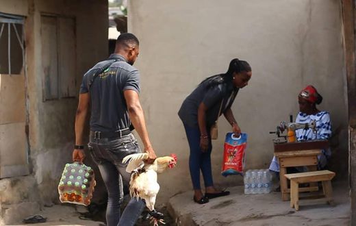 Lance Corporal Simon Agbeko gives to the aged