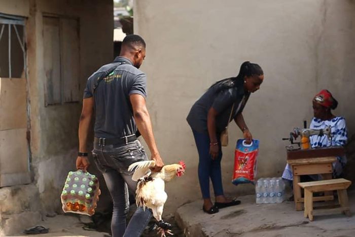 Lance Corporal Simon Agbeko gives to the aged