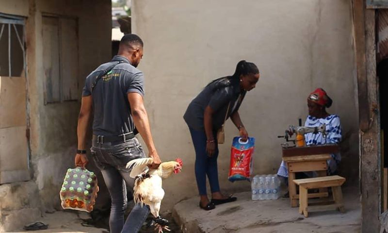 Lance Corporal Simon Agbeko gives to the aged