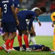 France's defender Benjamin Pavard (C) was hurt in a collision with German defender Robin Gosens
