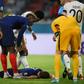 France's defender Benjamin Pavard (C) was hurt in a collision with German defender Robin Gosens