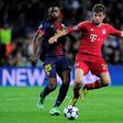 Alex Song (L) playing for Barcelona in a 2013 Champions League semi-final against Bayern Munich.