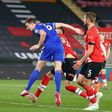 Leicester defender Jonny Evans (C) heads against Southampton