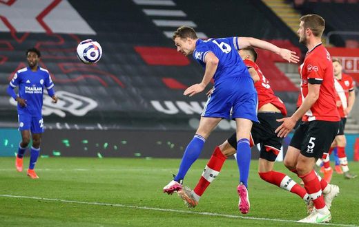 Leicester defender Jonny Evans (C) heads against Southampton