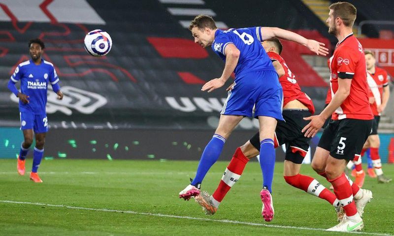 Leicester defender Jonny Evans (C) heads against Southampton