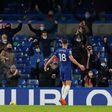 Olivier Giroud celebrates in front of the Chelsea fans, who were back at Stamford Bridge for the first time since March