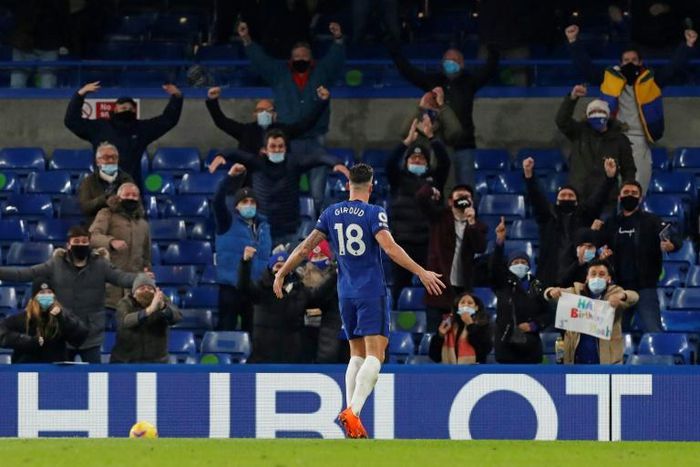Olivier Giroud celebrates in front of the Chelsea fans, who were back at Stamford Bridge for the first time since March