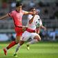 South Korea's Son Heung-min (L) and Lebanon's Kassem El Zein compete for the ball
