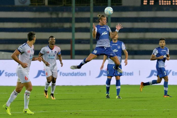 Erik Paartalu heads the ball during in an Indian Super League match against Delhi Dynamos. Defender Paartalu is the longest-serving Australian in India and now into his fourth season with Bengaluru FC