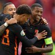 Georginio Wijnaldum (R) celebrates with Memphis Depay and Donyell Malen after scoring his second goal and the Netherlands' third against North Macedonia