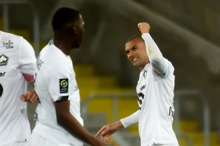 Burak Yilmaz celebrates his second goal as Lille in at Lens