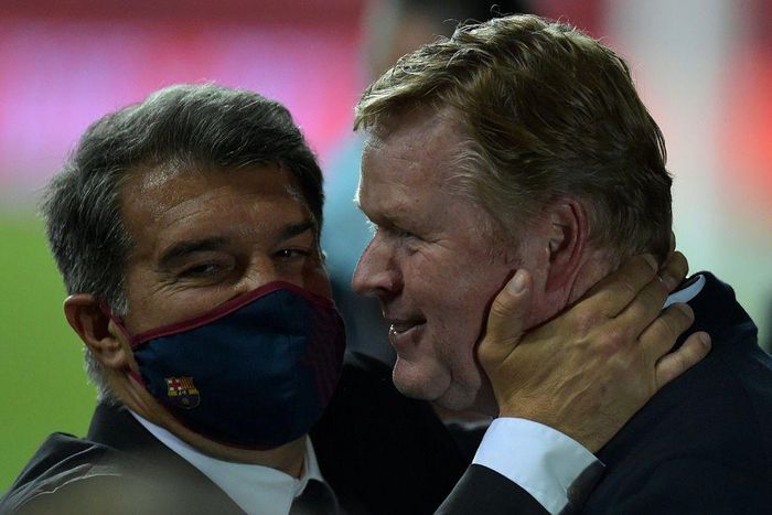 Team work: Barcelona coach Ronald Koeman celebrates with club president Joan Laporta at the end of last week's Copa del Rey