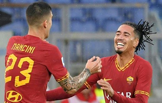 English defender Chris Smalling (R) joined Roma from Manchester United