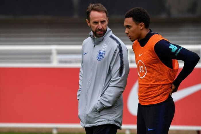 England manager Gareth Southgate (L) speaks with Liverpool defender Trent Alexander-Arnold
