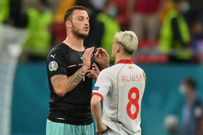 Arnautovic (L) spoke to Alioski (R) after the game