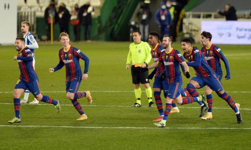 Barcelona celebrate their penalty shootout win over Real Sociedad in the semi-finals of the Spanish Super Cup