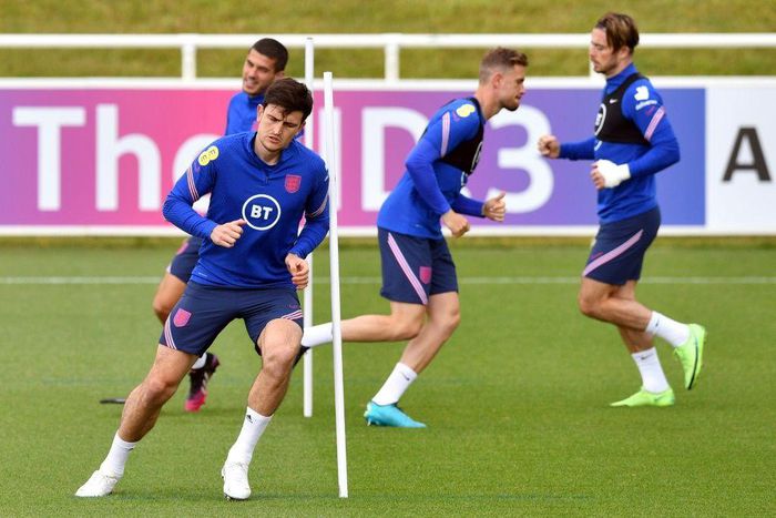 England defender Harry Maguire (left) is fit to return against Scotland