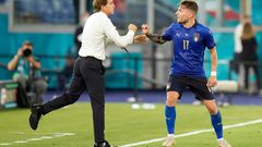 Ciro Immobile (R) celebrates Italy's third goal with coach Roberto Mancini