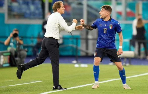 Ciro Immobile (R) celebrates Italy's third goal with coach Roberto Mancini