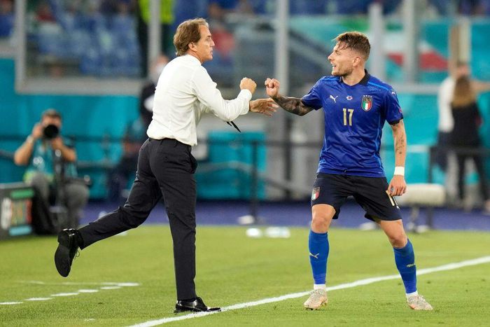 Ciro Immobile (R) celebrates Italy's third goal with coach Roberto Mancini