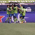 Irish defender Shane O'Neill, second from left, celebrates his goal with Seattle teammates as the Sounders defeated Dallas 1-0 on Tuesday in a Major League Soccer playoff quarter-final match