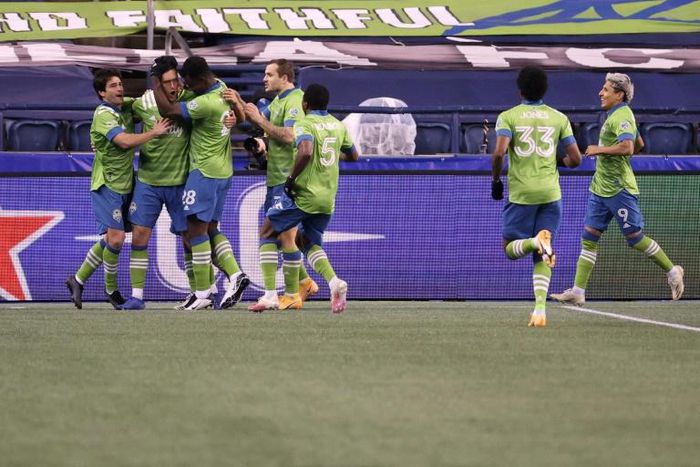 Irish defender Shane O'Neill, second from left, celebrates his goal with Seattle teammates as the Sounders defeated Dallas 1-0 on Tuesday in a Major League Soccer playoff quarter-final match