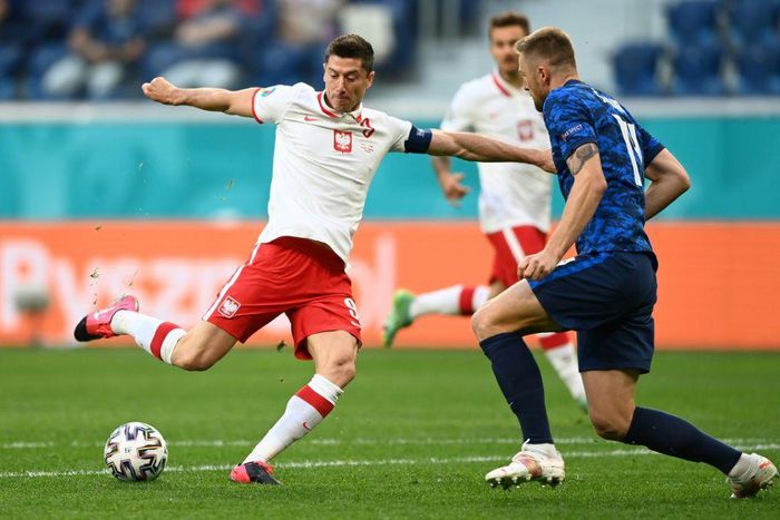 Robert Lewandowski (L) has scored just two goals in 12 matches for Poland at international tournaments