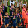 Japanese midfielder Saki Kumagai lifts the women's Champions League trophy after Olympique Lyon won last year's final against VfL Wolfsburg
