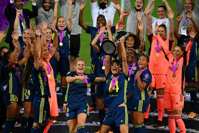 Japanese midfielder Saki Kumagai lifts the women's Champions League trophy after Olympique Lyon won last year's final against VfL Wolfsburg