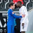 Hoffenheim's Sebastian Rudy separates Marcus Thuram from Stefan Posch