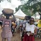 Captain Smart carrying a bag of cement
