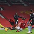 Bertrand Traore (C) shoots past Manchester United goalkeeper David de Gea to equalise for Aston Villa at Old Trafford