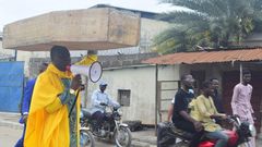Archbishop Samson Benjamin embarks on a one-man protest with a coffin on his head