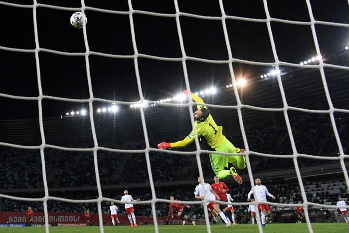 Top corner: Georgia's goalkeeper Giorgi Loria could not reach Dani Olmo's injury-time winner