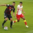 Bayern Munich forward Eric-Maxim Choupo Moting (L) shields the ball from Philipp Tschauner of RB Leipzig