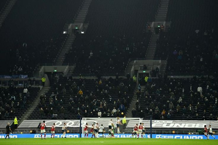 Fans returned to watch Harry Kane and Tottenham shut out Arsenal to stay top of the league