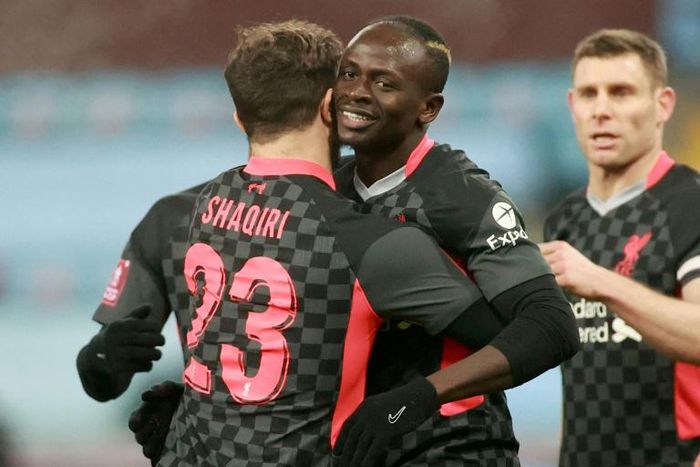 Liverpool's Sadio Mane (C) celebrates scoring against Aston Villa