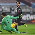 Mohamed Salah (R) scores his second goal for Liverpool against West Ham
