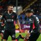 Closing in on Champions League: Nathaniel Phillips (centre)scored Liverpool's second goal in a 3-0 win over Burnley