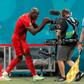 Belgium striker Lukaku (C) shouts his message to stricken Inter Milan team-mate Eriksen after scoring in Saint Petersburg