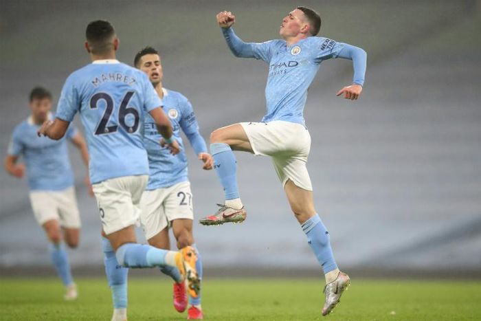Manchester City midfielder Phil Foden (right) celebrates scoring against Brighton
