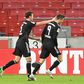 Bayern Munich striker Robert Lewandowski (R) celebrates scoring his 15th goal this season in all competitions