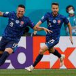 Robert Mak (L) runs off celebrating after his strike helped put Slovakia ahead