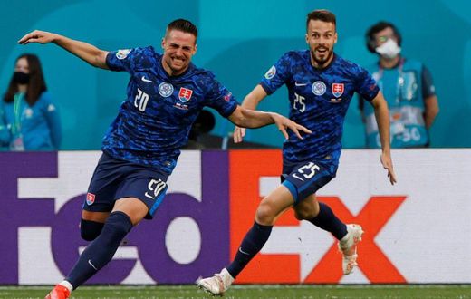 Robert Mak (L) runs off celebrating after his strike helped put Slovakia ahead